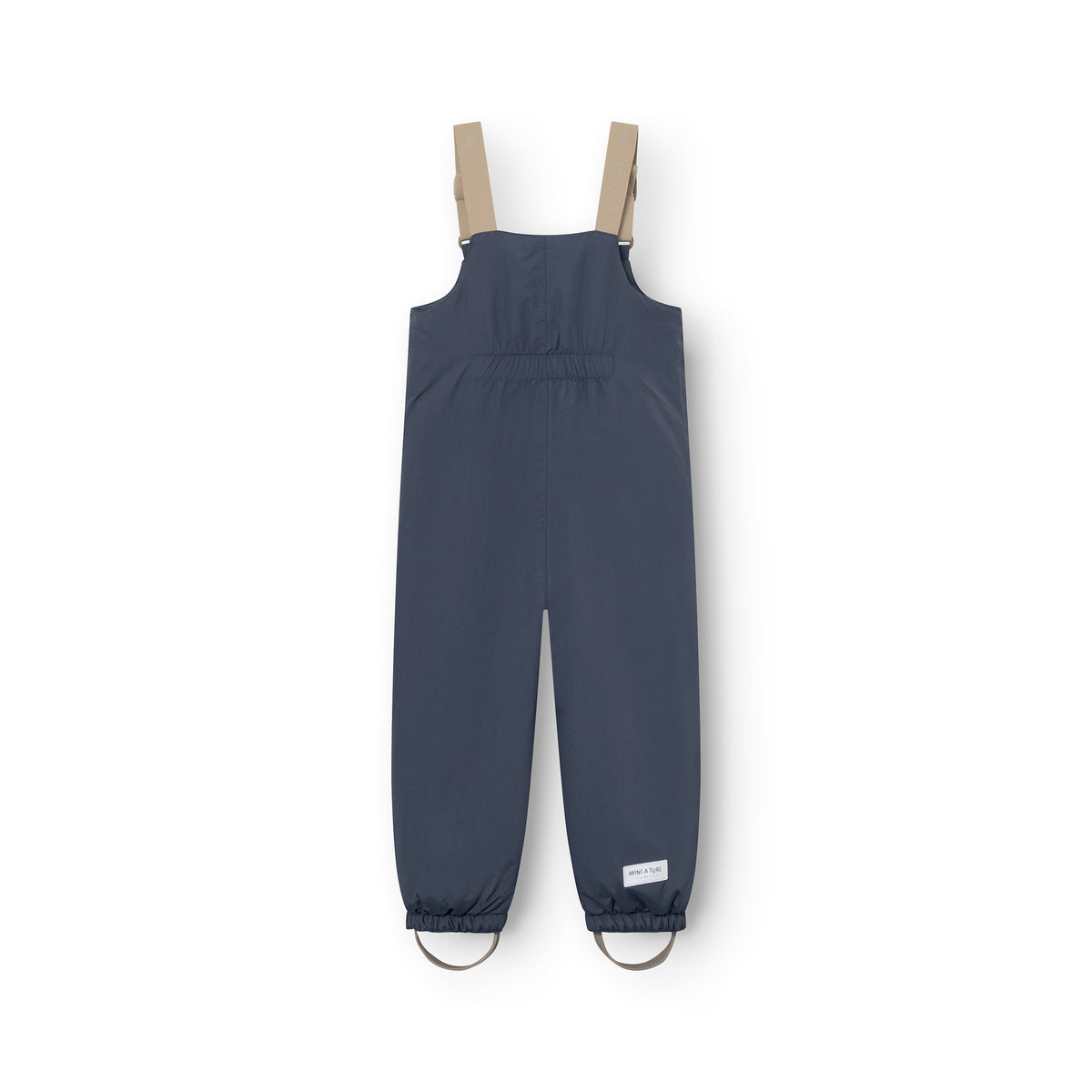 MATWALENTEXO all season-overtræksshorts i mørkeblå set bagfra, med beige justerbare seler, elastik i taljen og fodstropper ved anklerne samt MINI A TURE-mærkat på det højre bukseben.