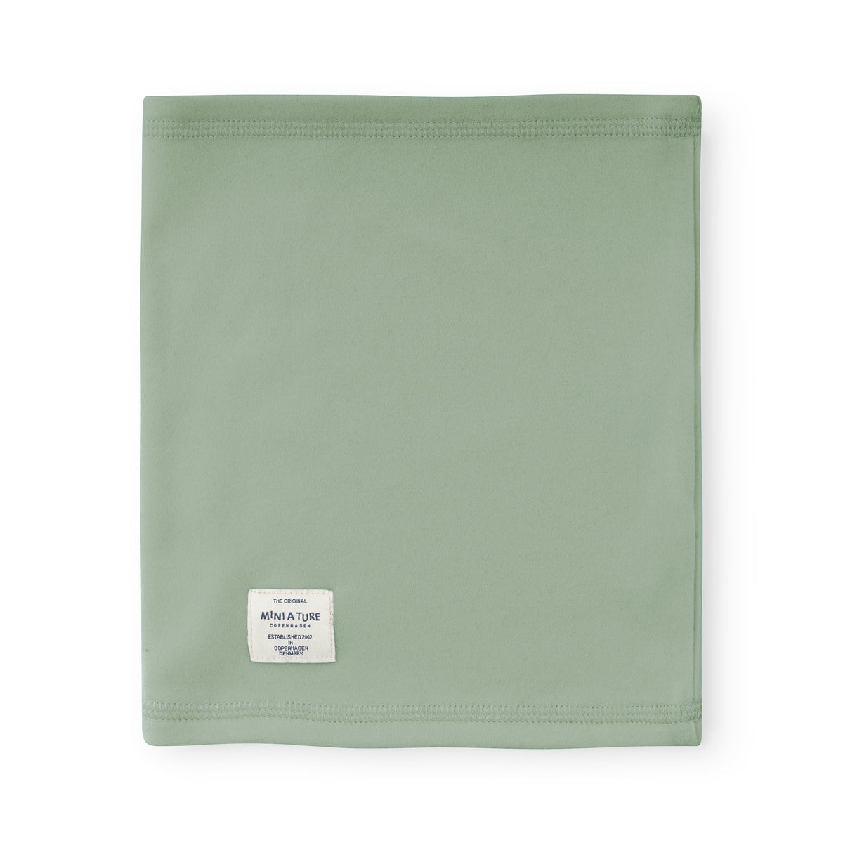 MATAKON let fleece-halsedisse til børn i farven Chinois Green, fotograferet fladt med MINI A TURE-mærket synligt foran på den rørformede, ensfarvede grønne halsedisse.