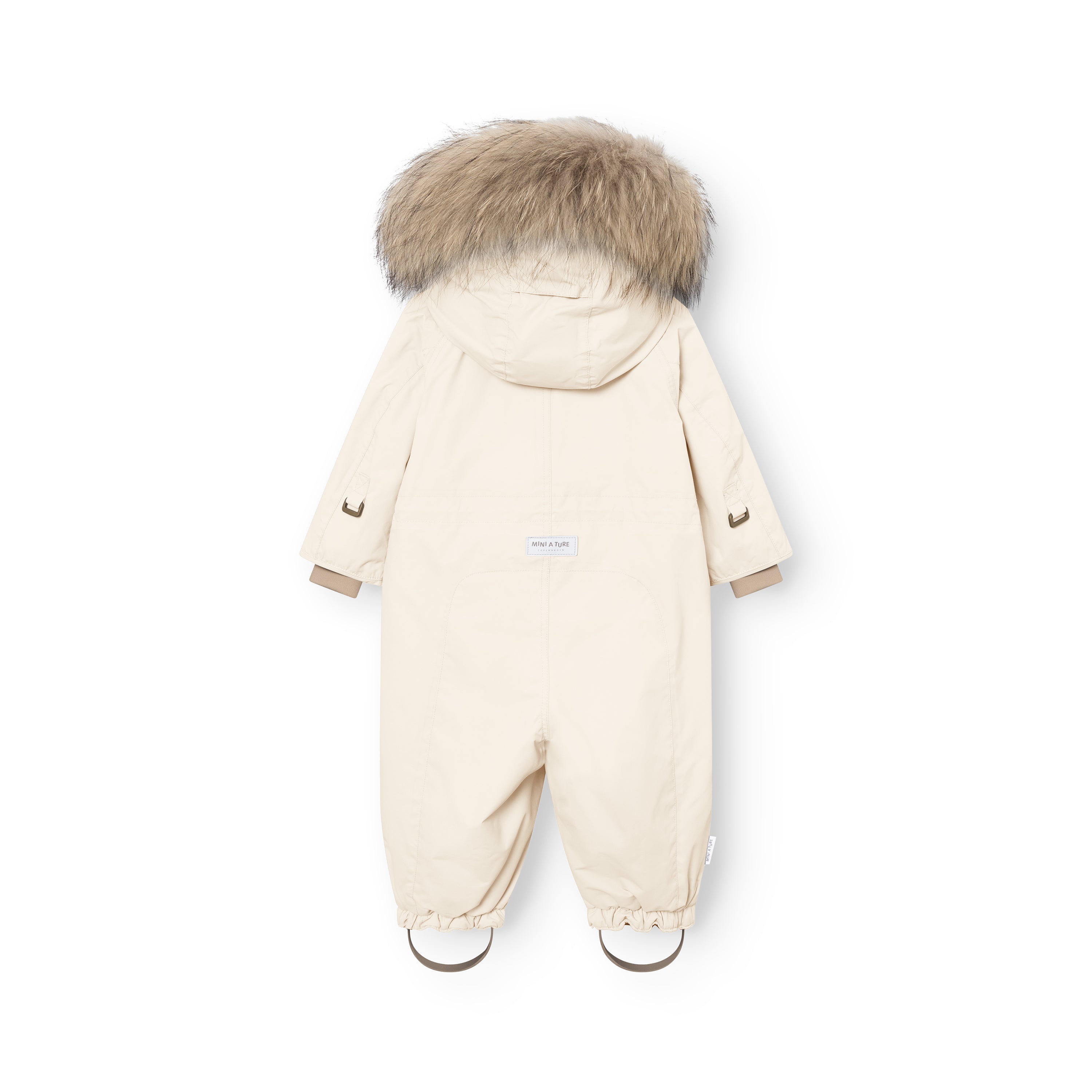MATWISTI fleeceforet flyverdragt med pels i lys cremefarve set bagfra i fuld længde. Den har en stor, naturlig pelskant øverst på hætten, og MINI A TURE-mærkatet er placeret centralt på ryggen. Beige manchetter stikker frem ved håndleddene, og de rynkede bukseben med beige fodstropper er synlige ved begge ankler.