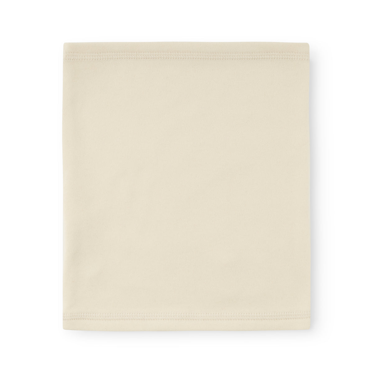 MATAKON let fleece-halsedisse til børn i farven Angora Cream, set oppefra som et udfoldet rør med synlige ribkanter øverst og nederst på det bløde, ensfarvede cremefarvede materiale.